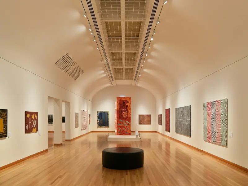 Gallery room hung with colourful contemporary paintings