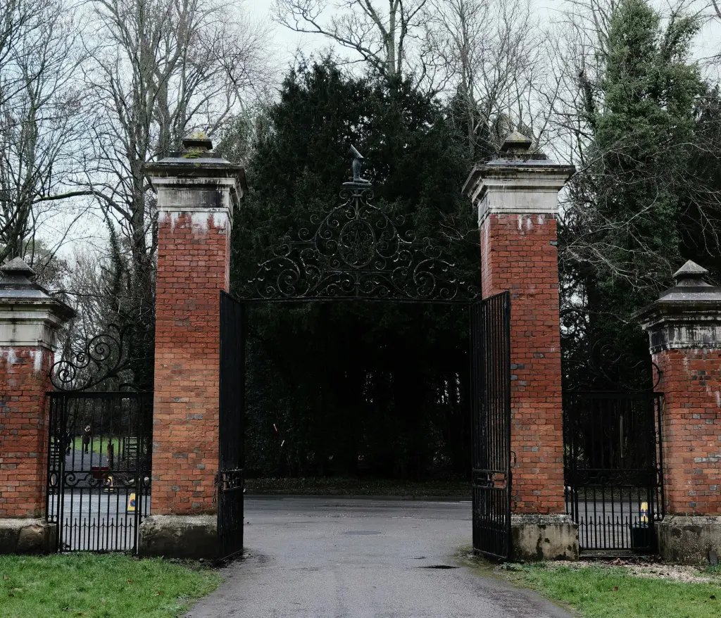 Wrought iron gates and brick pillars at the entrance to an estate