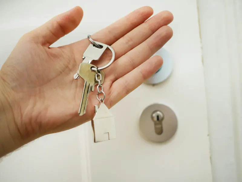 House keys held out in an open hand